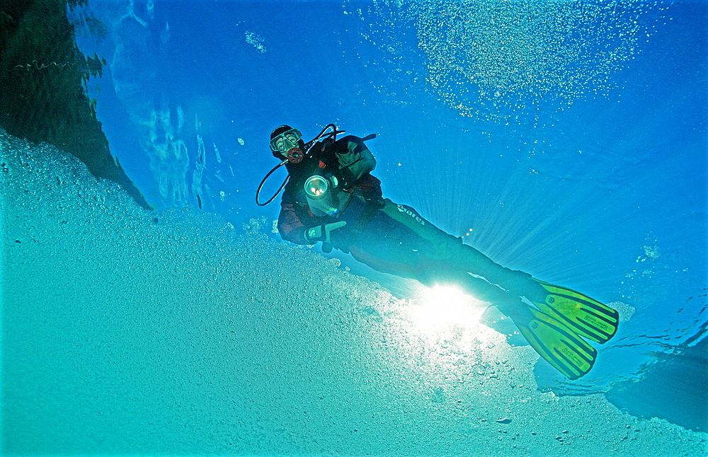 Ice diving, Scuba diver under ice, Austria, Tirol