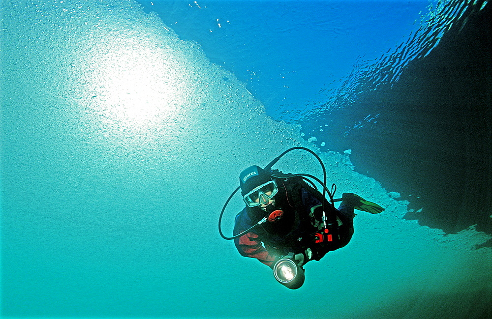 Ice diving, Scuba diver under ice, Austria, Tirol