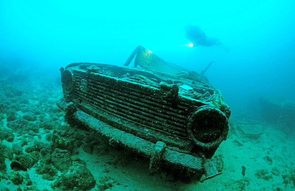 car wreck underwater and scuba diver, Croatia, Istria, Mediterranean Sea