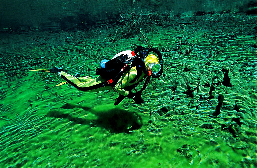 Scuba diver in mountain lake, Austria, Tirol
