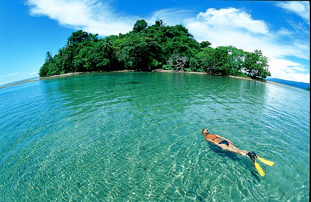 Snorkeling near an island, Scin diver, Papua New Guinea, Pacific ocean