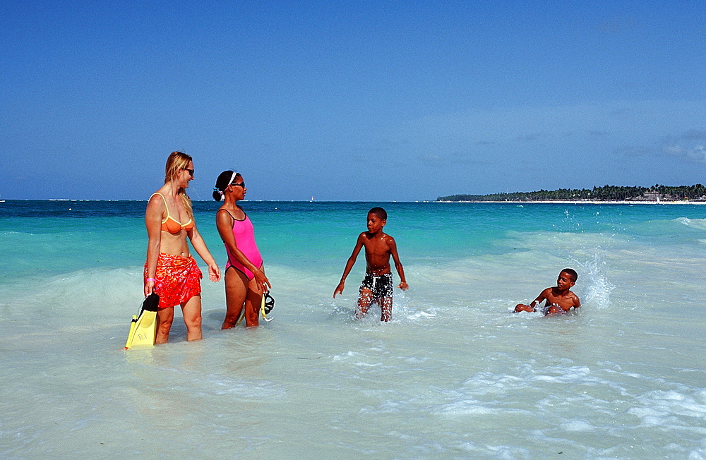 Two female skin divers on the beach, Punta Cana, Dominican Republic, West Indies, Caribbean, Central America