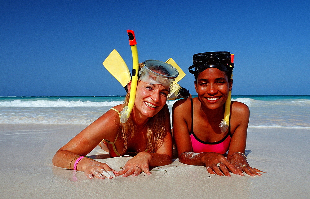 Two female skin divers on the beach, Punta Cana, Dominican Republic, West Indies, Caribbean, Central America