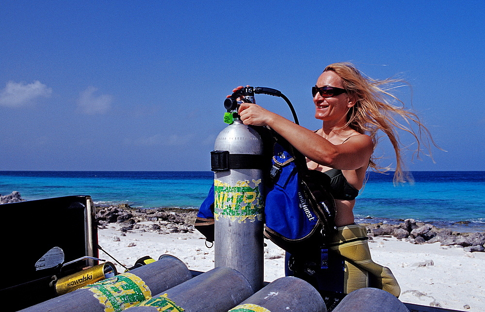 Diver on the rental car, Netherlands Antilles, Bonaire, Caribbean Sea