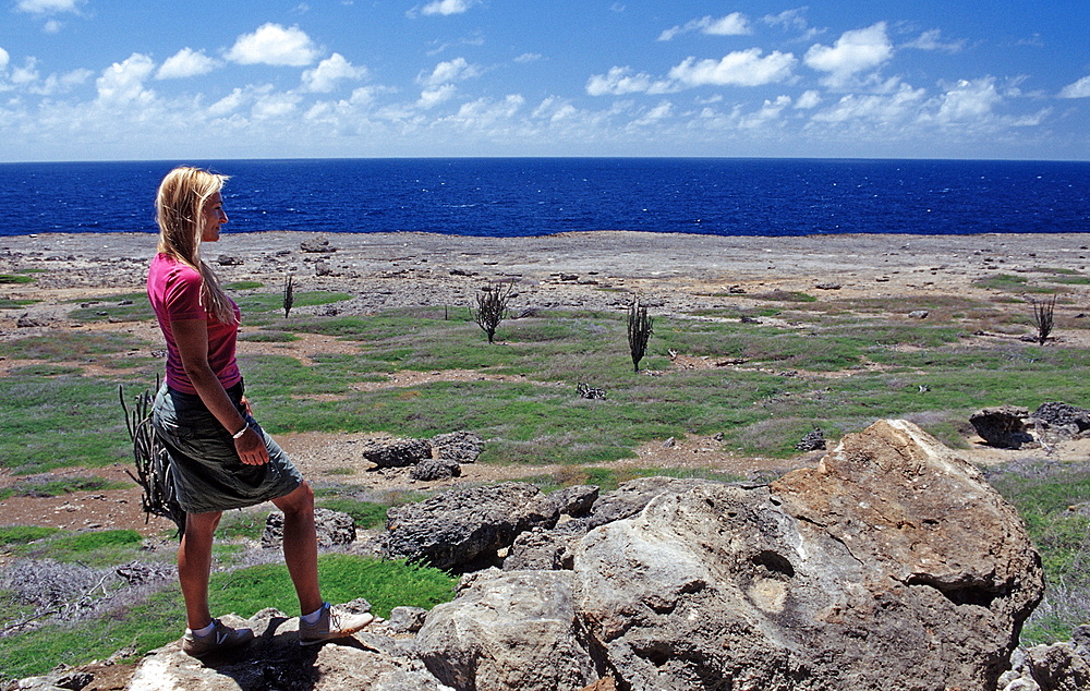 Woman and Desert landscape, Netherlands Antilles, Bonaire, Bonaire, Washington Slagbaai National Park