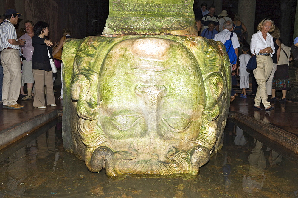 Tourists at Medusa in Yerebatan Sarayi Cistern, Istanbul, Turkey