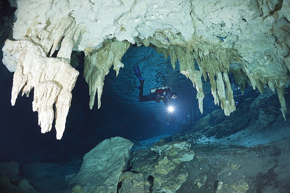 Scuba diver at Dos Ojos Cenote, Playa del Carmen, Yucatan Peninsula, Mexico