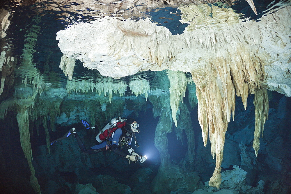 Scuba diver at Dos Ojos Cenote, Playa del Carmen, Yucatan Peninsula, Mexico