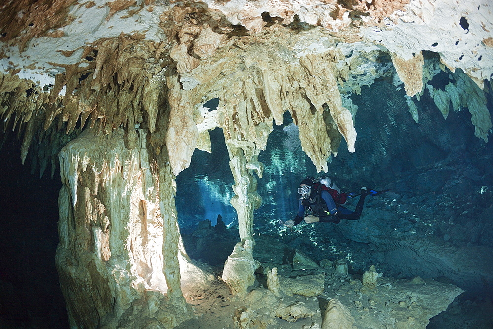 Scuba diver at Dos Ojos Cenote, Playa del Carmen, Yucatan Peninsula, Mexico