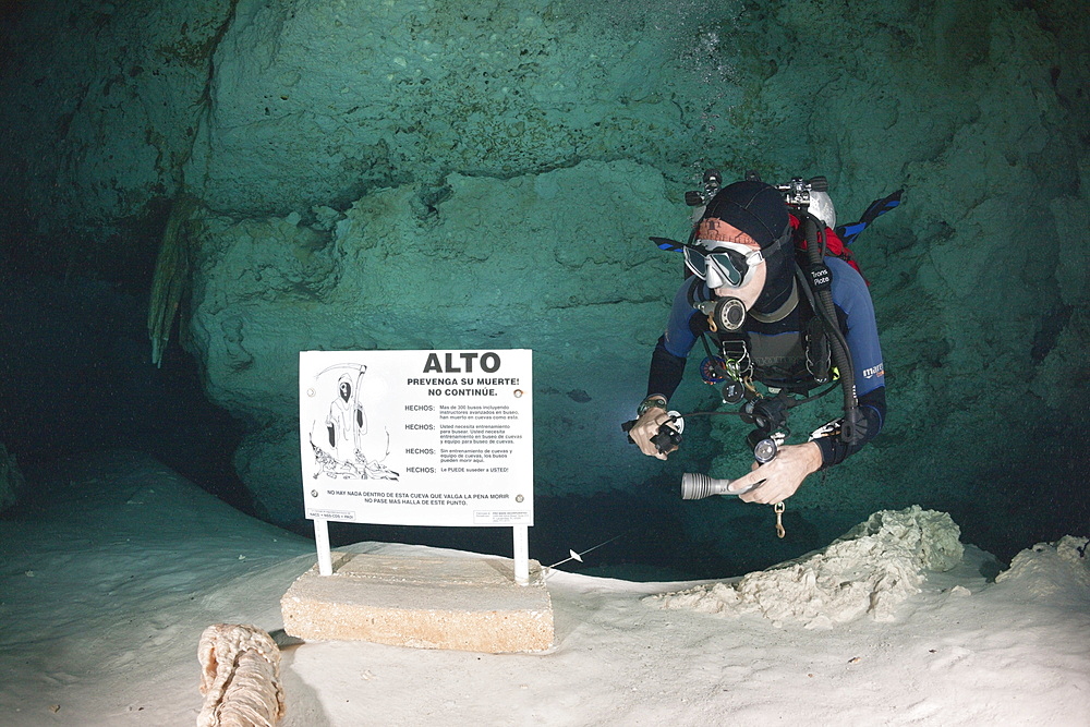 Scuba diver at Dos Ojos Cenote, Playa del Carmen, Yucatan Peninsula, Mexico