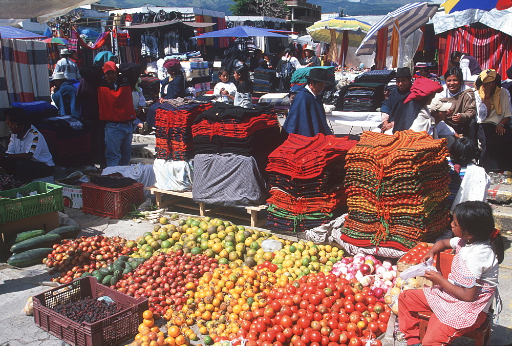 Otavalo, north of Quito is one of Latin Am's most famous markets for textiles, crafts and produce vendors in the produce market, Quito, Ecuador