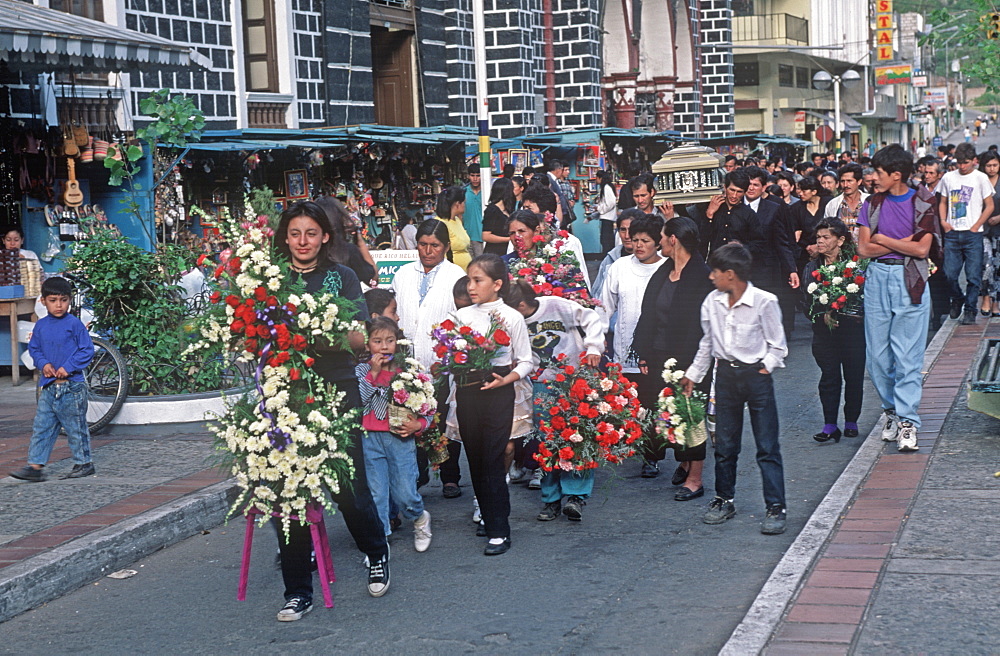 Banos resort and famous hot springs in semitropical area Basilica of Senora de Agua Santa, traditional funeral procession, Highlands, Ecuador