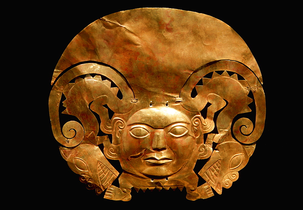 Gold Artifacts Mochica Culture, 200-800AD, Classic Period gold breastplate (pectoral) in human and animal form Rafael Herrera Museum, Lima, Peru