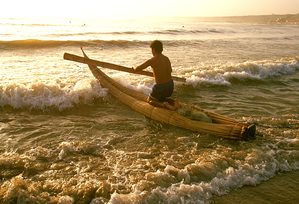 Caballitos de totora', small fishing boats woven of totora reeds in a style unchanged since pre-Inca times at Huanchaco beach, Trujillo, North Coast, Peru