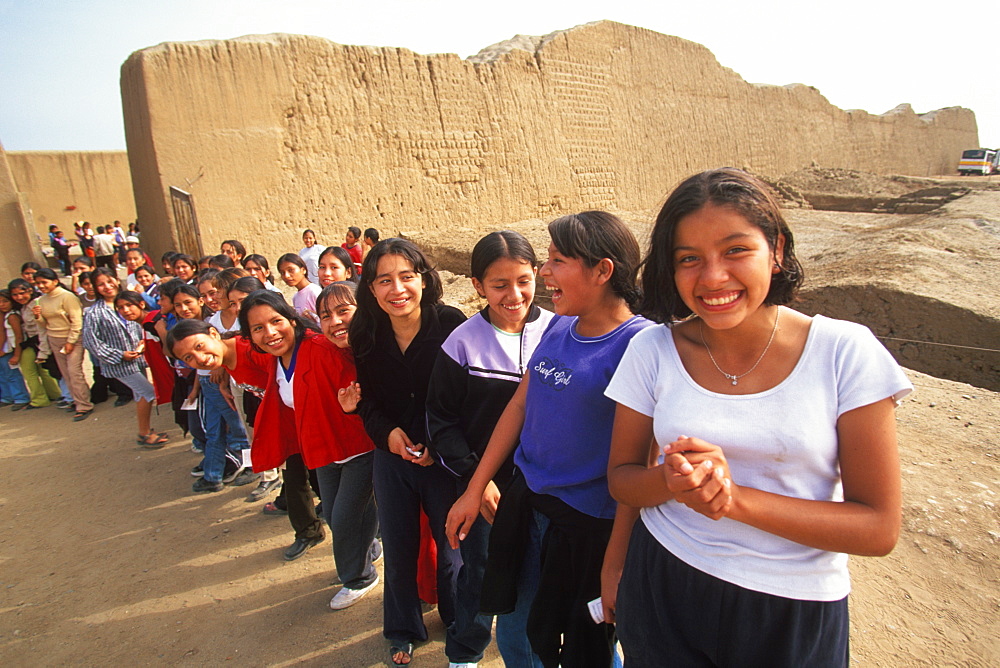 Chimu Culture Chan Chan, 1300-1468AD, capital of empire and world's largest adobe city covering 20 sqkm near Trujillo students in Palacio Tschuldi, Peru