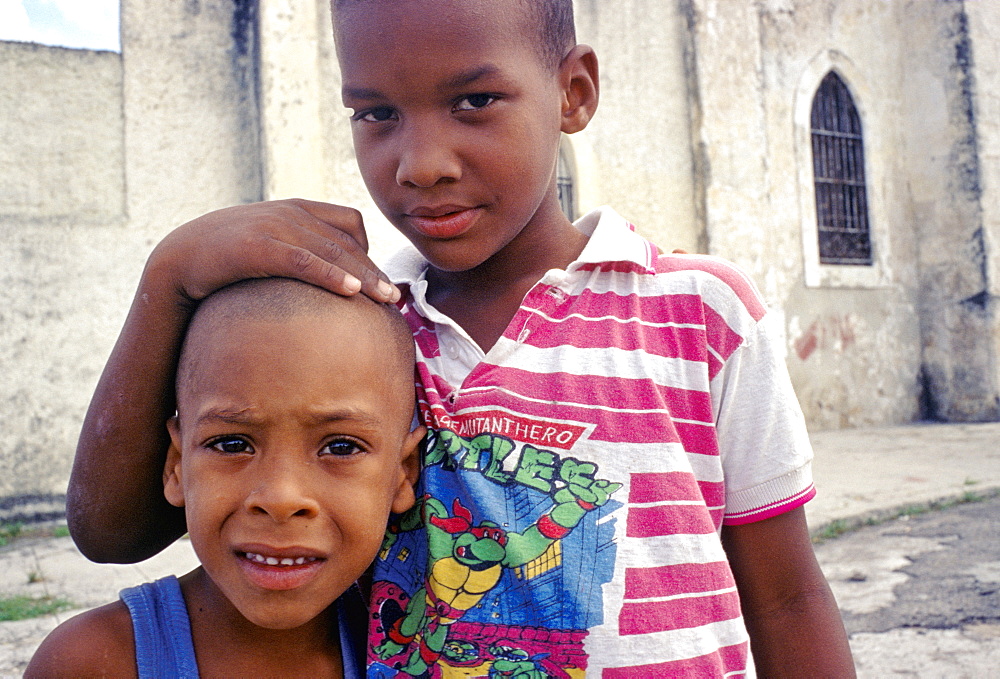 Portrait of two young Cuban boys in the street in the El Cerro district of Havana, Cuba