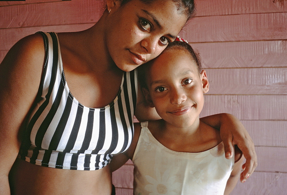 Portrait of two sisters in their home in the rural town of La Serafina in the southern area of Havana Province, Cuba