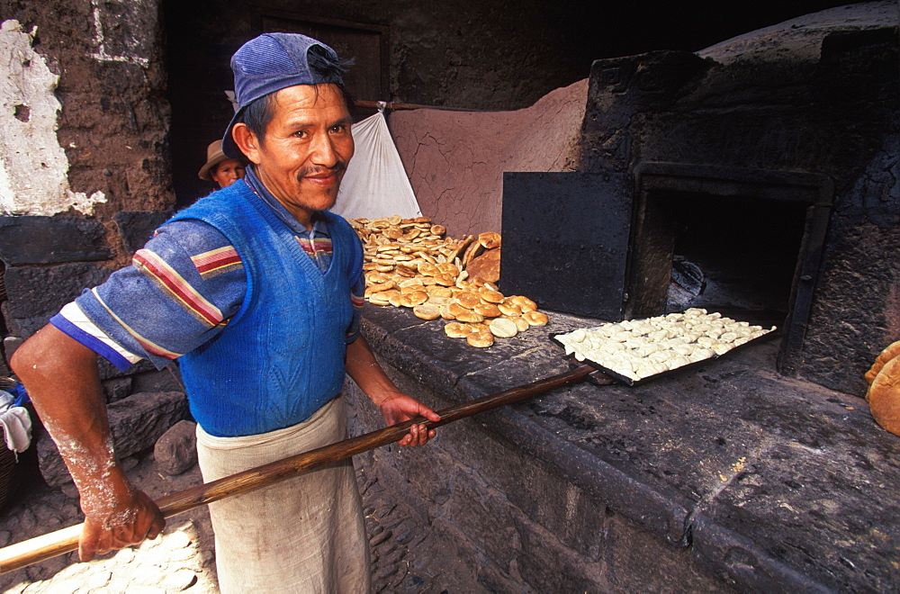 Pisac Village in the Valley of the Incas Sunday Market, one of the world's most colorful markets village baker, Cuzco area, Highlands, Peru