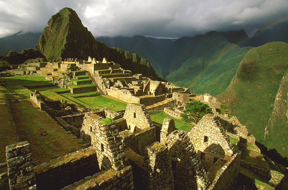 Machu Picchu view of the ancient city with Huayna Picchu Peak above the Rio Urubamba in the Vilcabamba Mountains, Highlands, Peru