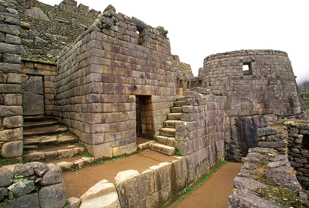 Inca Machu Picchu skillfully carved, curved wall of the Sun Temple, is considered to be the finest stone construction in the site, Highlands, Peru