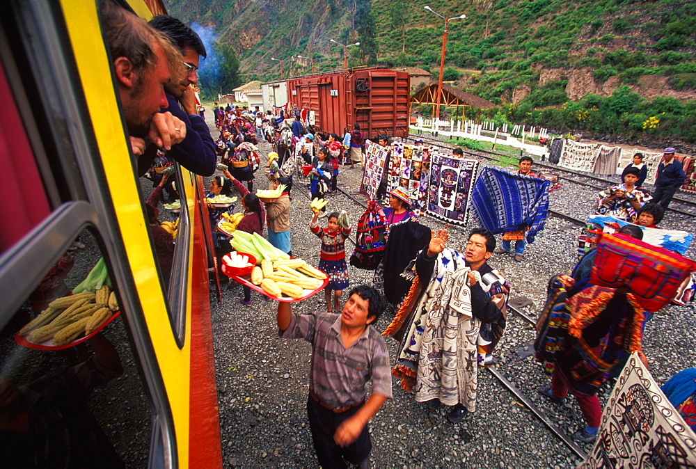 One of the world's most famous train rides thru the Inca Sacred Valley between Cuzco and Machu Picchu vendors and passengers, Peru