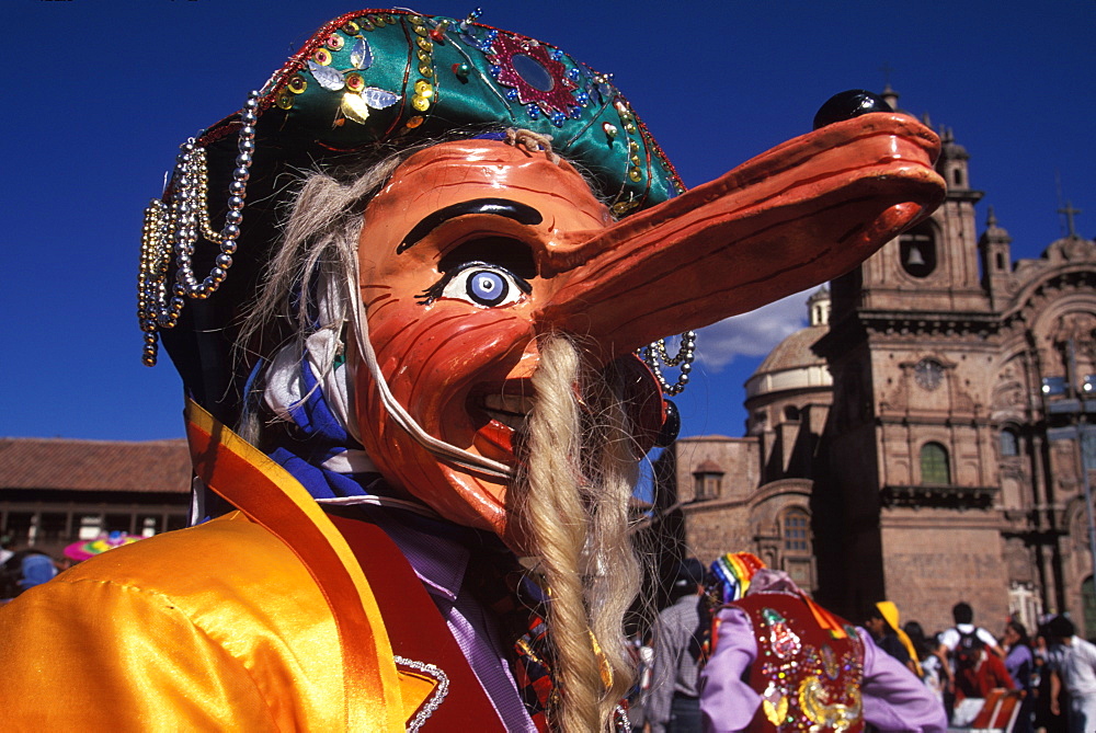 Corpus Christi is one of Peru's most famous festivals, costumed dancers perform the colonial mestizo Cholo in Plaza de Armas, Cuzco, Peru