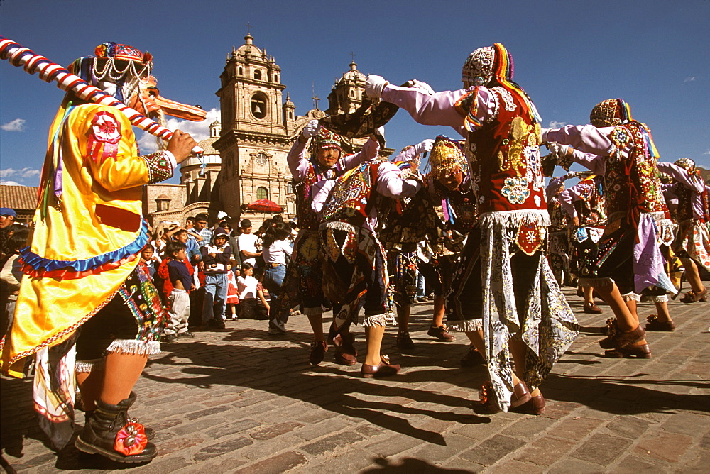 Corpus Christi is one of Peru's most famous festivals, costumed dancers perform the colonial mestizo Cholo in Plaza de Armas, Cuzco, Peru