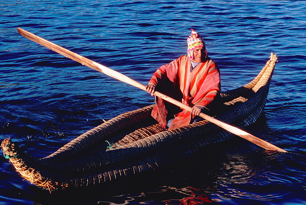 Floating islands of the Uros near Puno an ancient culture, noted for making traditional boats of woven totora reeds, Lake Titicaca, Peru