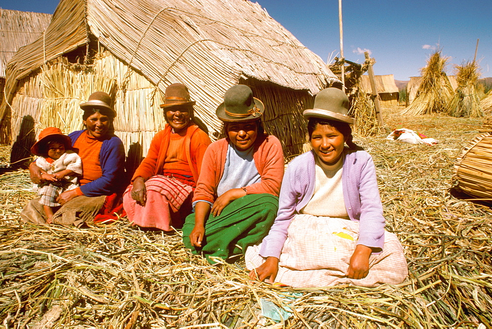 Floating islands of the Uros near Puno an ancient culture, noted for making boats and homes of woven totora reeds, Lake Titicaca, Peru