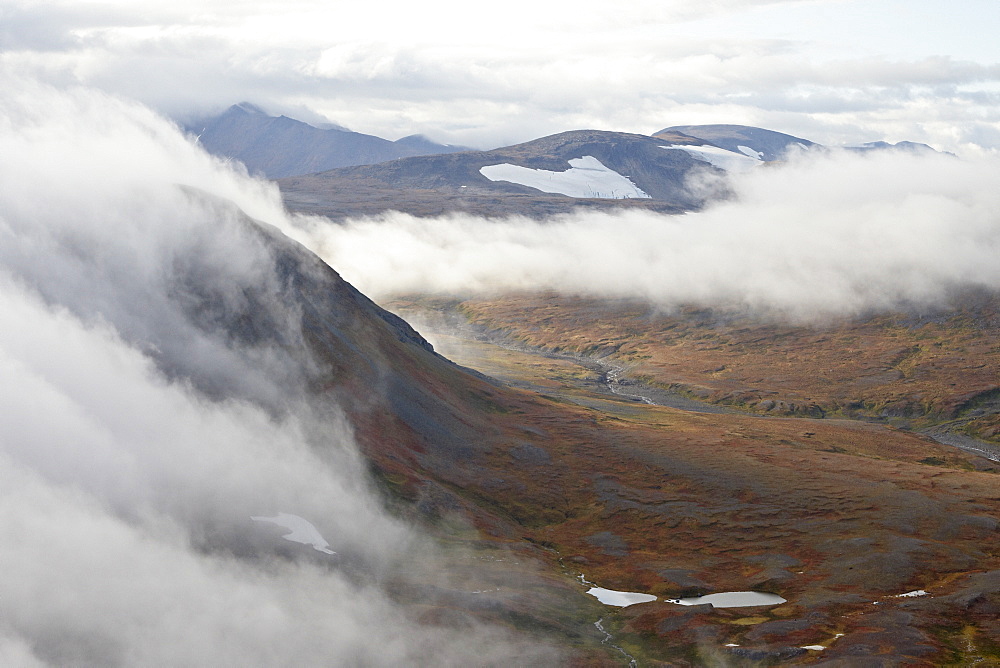 Clouds and mountains and tundra in the fall, Katmai Peninsula, Alaska, United States of America, North America