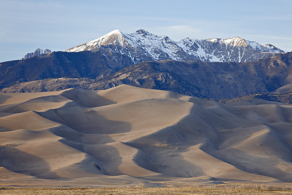 Great Sand Dunes and mountains with snow, Great Sand Dunes National Park and Preserve, Colorado, United States of America, North America