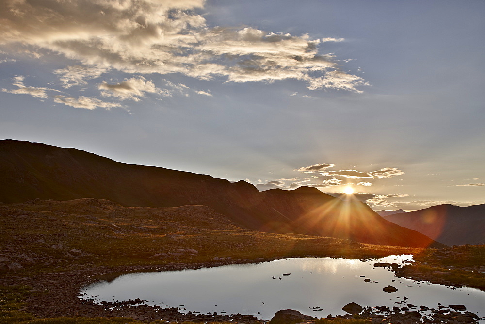 Sunset over an Alpine tarn at Stoney Pass, San Juan National Forest, Colorado, United States of America, North America