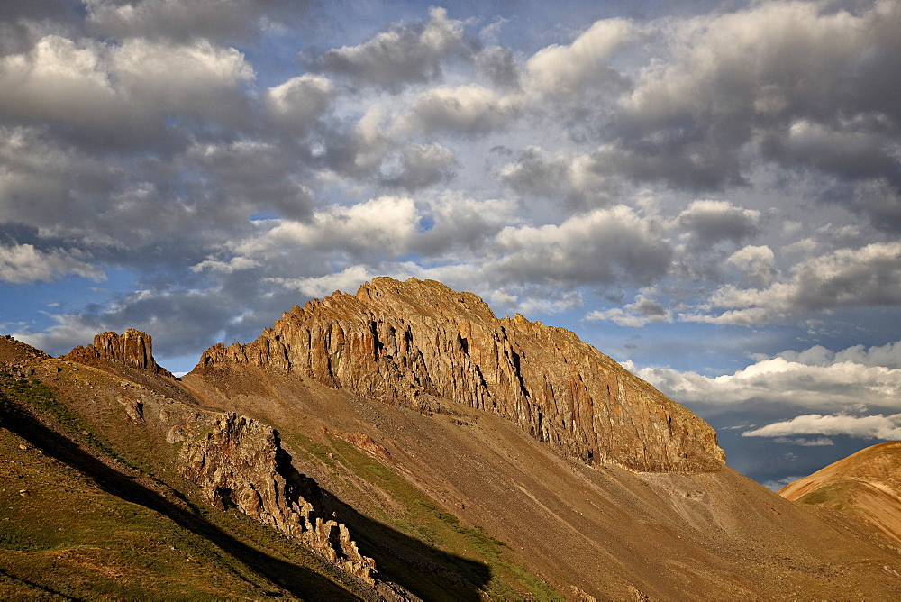 Jagged ridge with puffy clouds, Rio Grande National Forest, Colorado, United States of America, North America