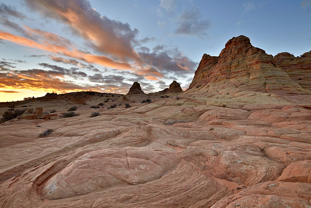 Orange clouds at sunrise above sandstone formations, Coyote Buttes Wilderness, Vermillion Cliffs National Monument, Arizona, United States of America, North America 