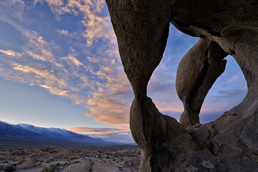 Sunset through Cyclops' Skull Arch, Alabama Hills, Inyo National Forest, California, United States of America, North America