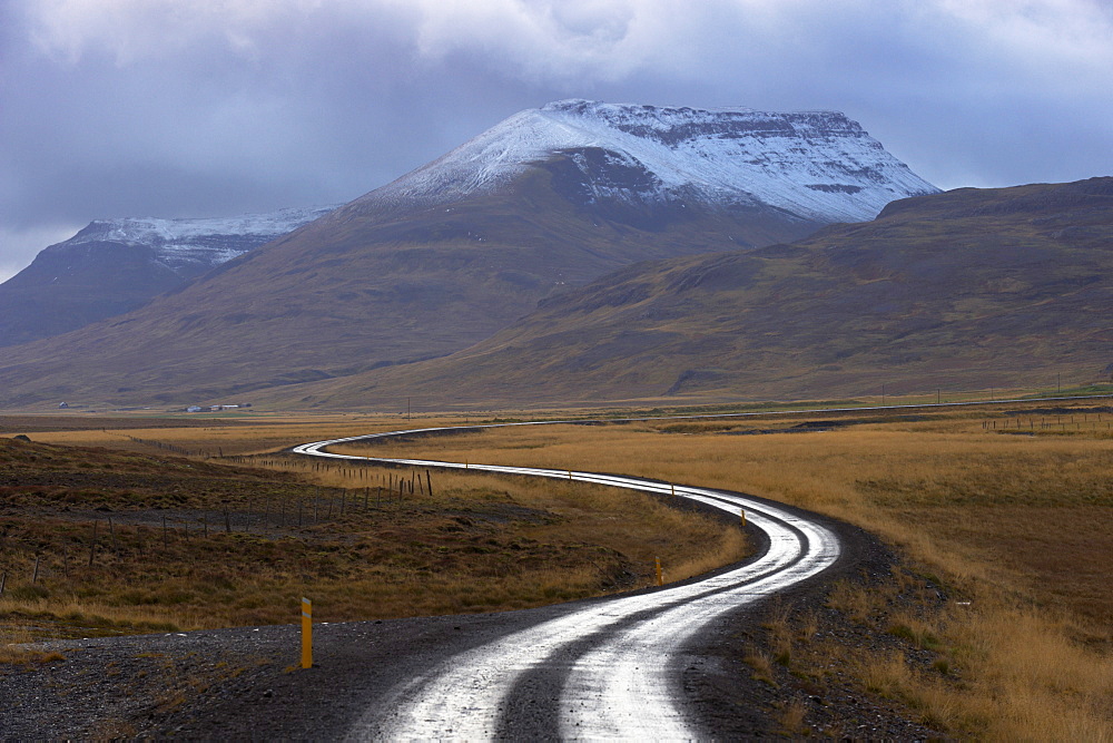 Road and landscape in Vatsnes Peninsula, with snow-covered mountains in October, north coast of Iceland, Iceland, Polar Regions