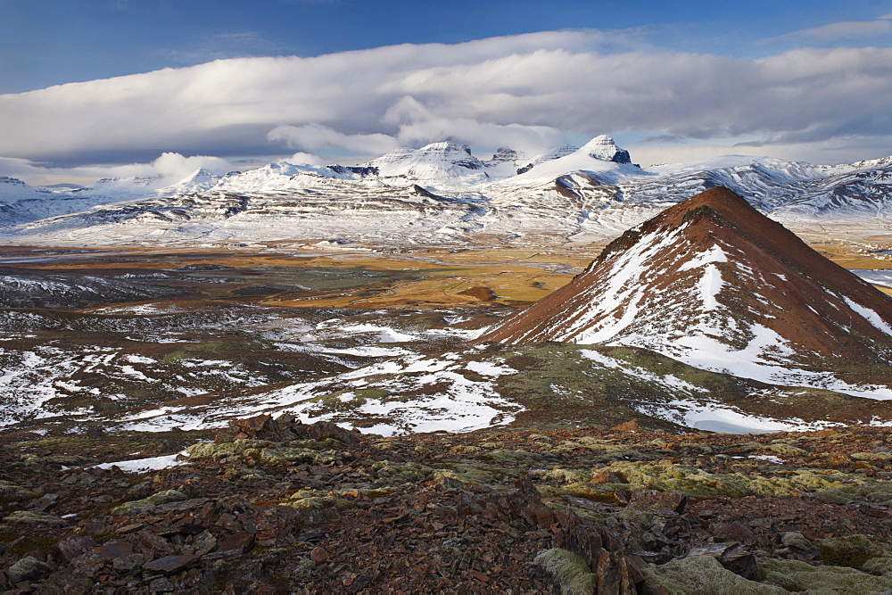 View over Fjardara valley, Borgarfjorur Eystri fjord, Bakkagerdi village and Mount Dyrfjoll (Door Mountain), 1136m, in the distance, from east side of the fjord, East Fjords area, Iceland, Polar Regions