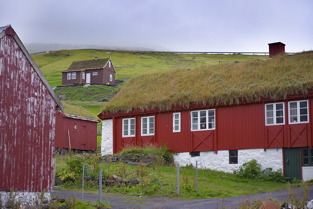 Turf-roofed timber houses at Elduvik, Eysturoy, Faroe Islands (Faroes), Denmark, Europe