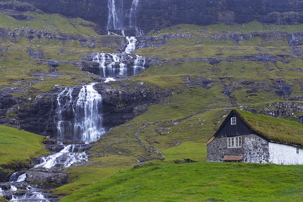 Old farm at Saksun and waterfall, Streymoy, Faroe Islands (Faroes), Denmark, Europe