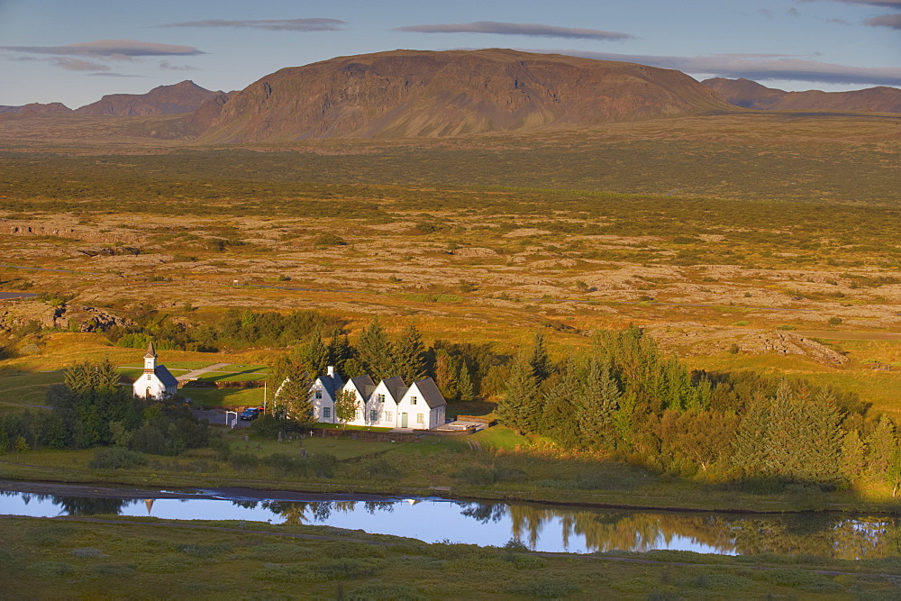 Thingvellir national church and Thingvallabaer, a five-gabled farmhouse, official summer residence of Iceland's Prime Minister, on the banks of River Oxara, Thingvellir National Park, UNESCO World Heritage Site, south-west of Iceland (Sudurland), Iceland, Polar Regions