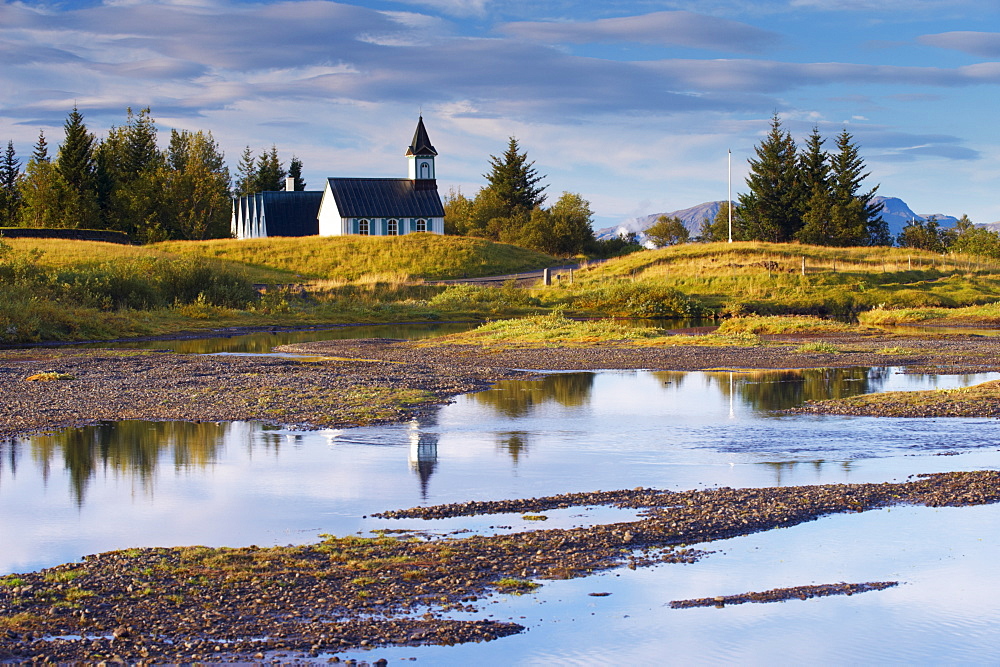 Thingvellir national church, built in 1859 on the site of Iceland's first church constructed in 1000 AD, seen from Oxaraholmi, an island in the River Oxara, site of legal duelling in the past, Thingvellir National Park, UNESCO World Heritage Site, south-west Iceland (Sudurland), Iceland, Polar Regions