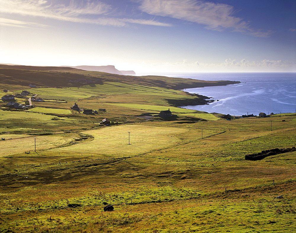 View of Trebister (Gulberwick) and Trebister Ness, south of Lerwick in a morning light, Bressay visible in the distance and The Ord cliffs and Bard Head, Mainland, Shetland Islands, Scotland, United Kingdom, Europe