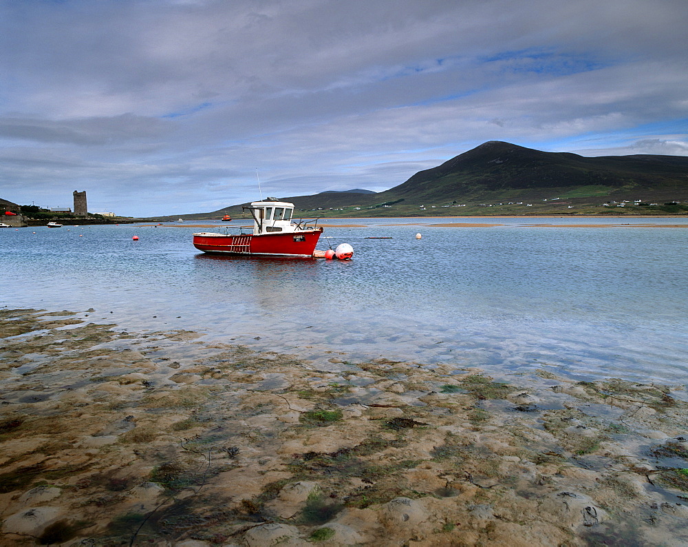 Red boat in Achill Sound at low tide, Achill Island, County Mayo, Connacht, Republic of Ireland, Europe