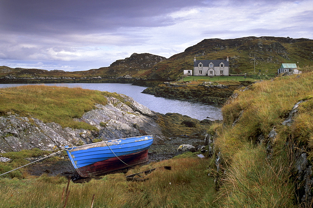 Blue boat and house, Ardslave, east coast of South Harris, Outer Hebrides, Scotland, United Kingdom, Europe, Europe