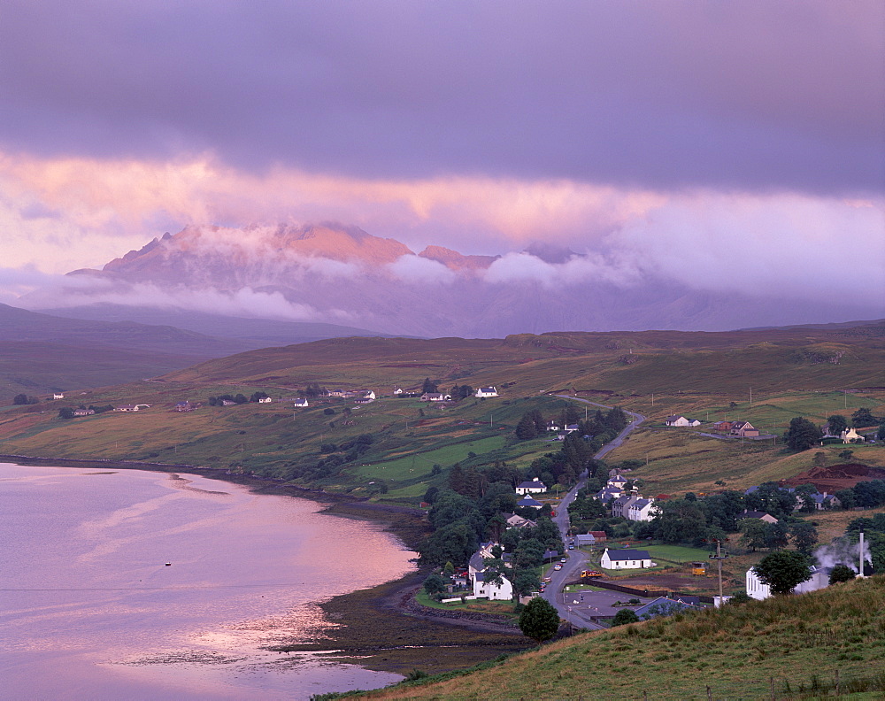 Croftship of Carbost, Loch Harport and the Black Cuillins range in cloud at sunset, Isle of Skye, Inner Hebrides, Highland region, Scotland, United Kingdom, Europe