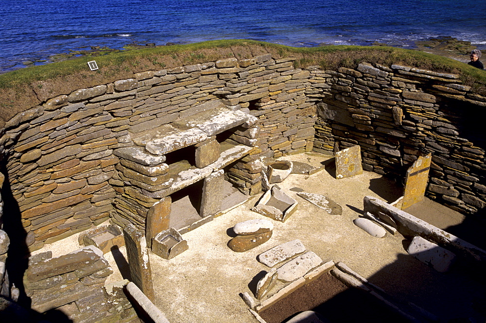 One of eight stone houses with stone furniture including beds, a central hearth and stone dresser, Skara Brae, neolithic village dating from between 3200 and 2200 BC, UNESCO World Heritage Site, Mainland, Orkney Islands, Scotland, United Kingdom, Europe