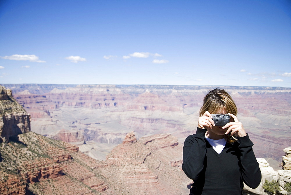 Woman taking photos, Grand Canyon National Park, UNESCO World Heritage Site, Arizona, United States of America, North America