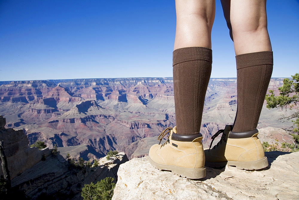 Woman looking over Grand Canyon, Grand Canyon National Park, UNESCO World Heritage Site, Arizona, United States of America, North America