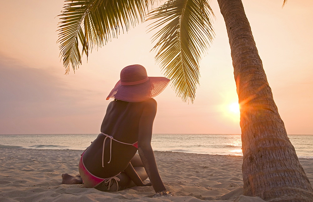 Jamaican woman on beach at sunset, Negril, Jamaica, West Indies, Caribbean, Central America