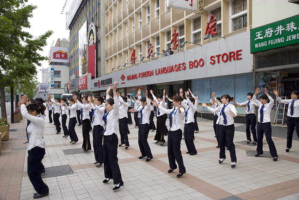 Store workers exercising before work, Wangfujing Road, Beijing, China, Asia